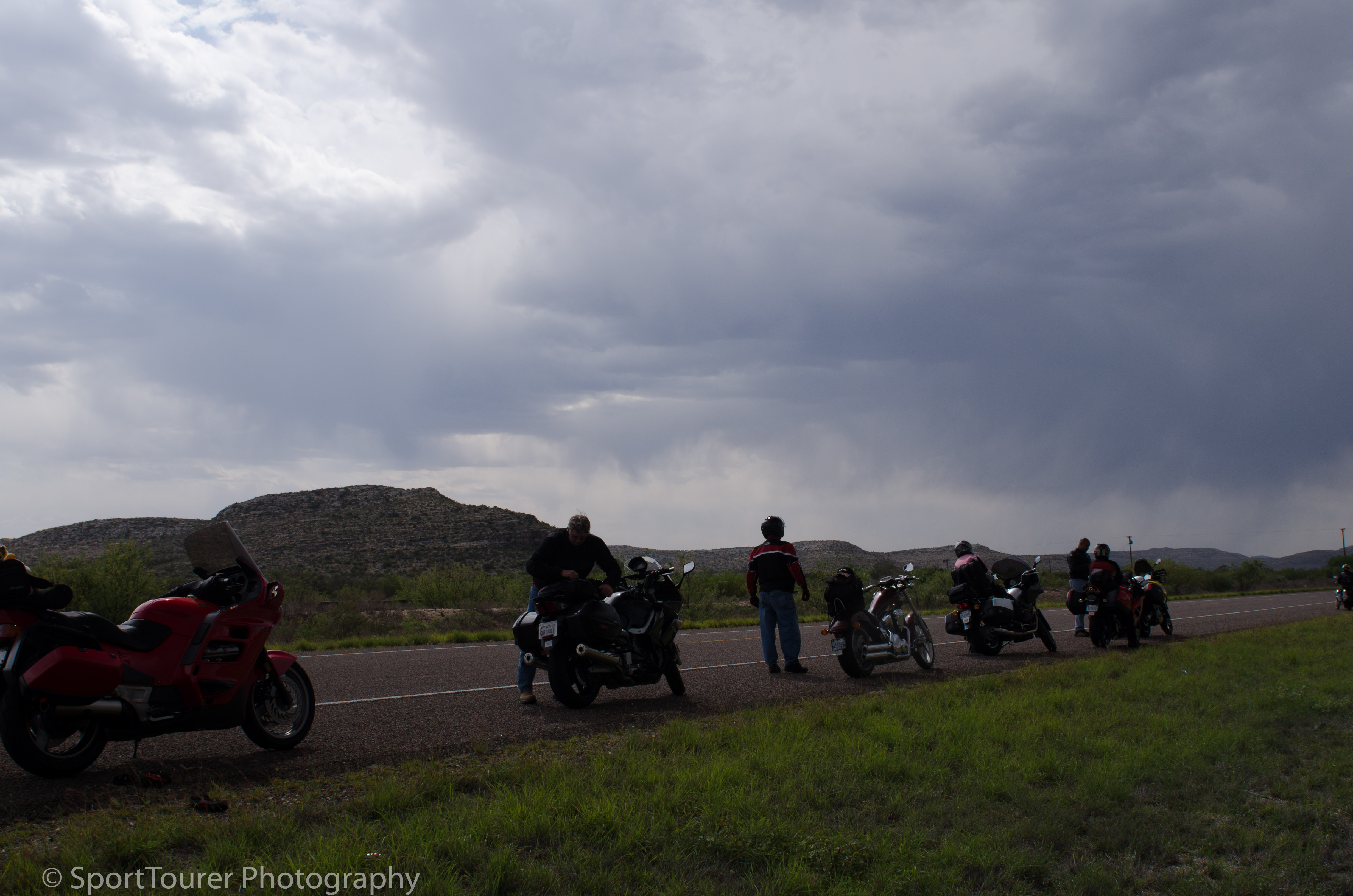  Pulling over at the side of the road to assess the threat of rain. 