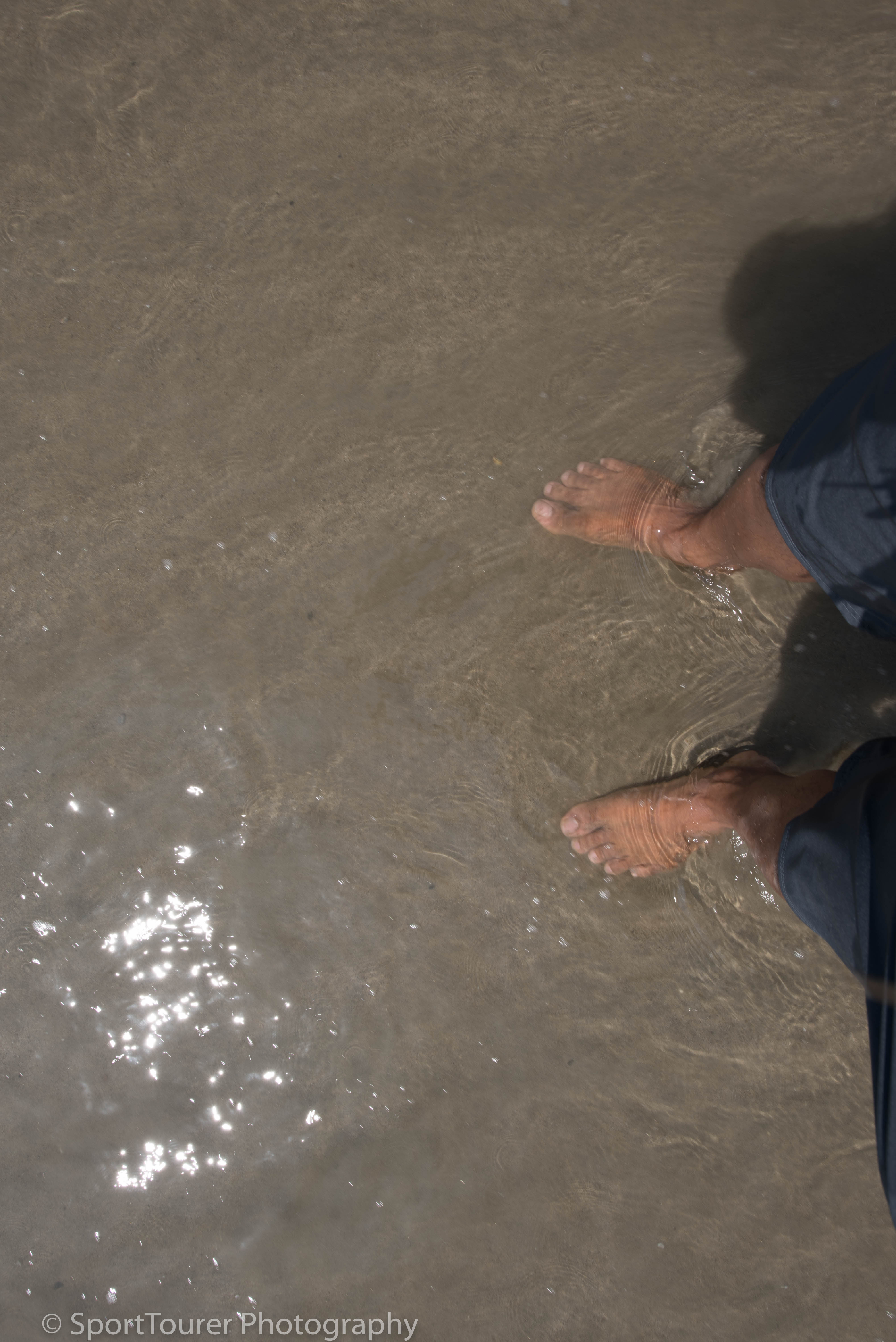  cooling off my hot, sunshine-deprived feet in the cool waters of the Pacific Ocean at Santa Monia Beach 