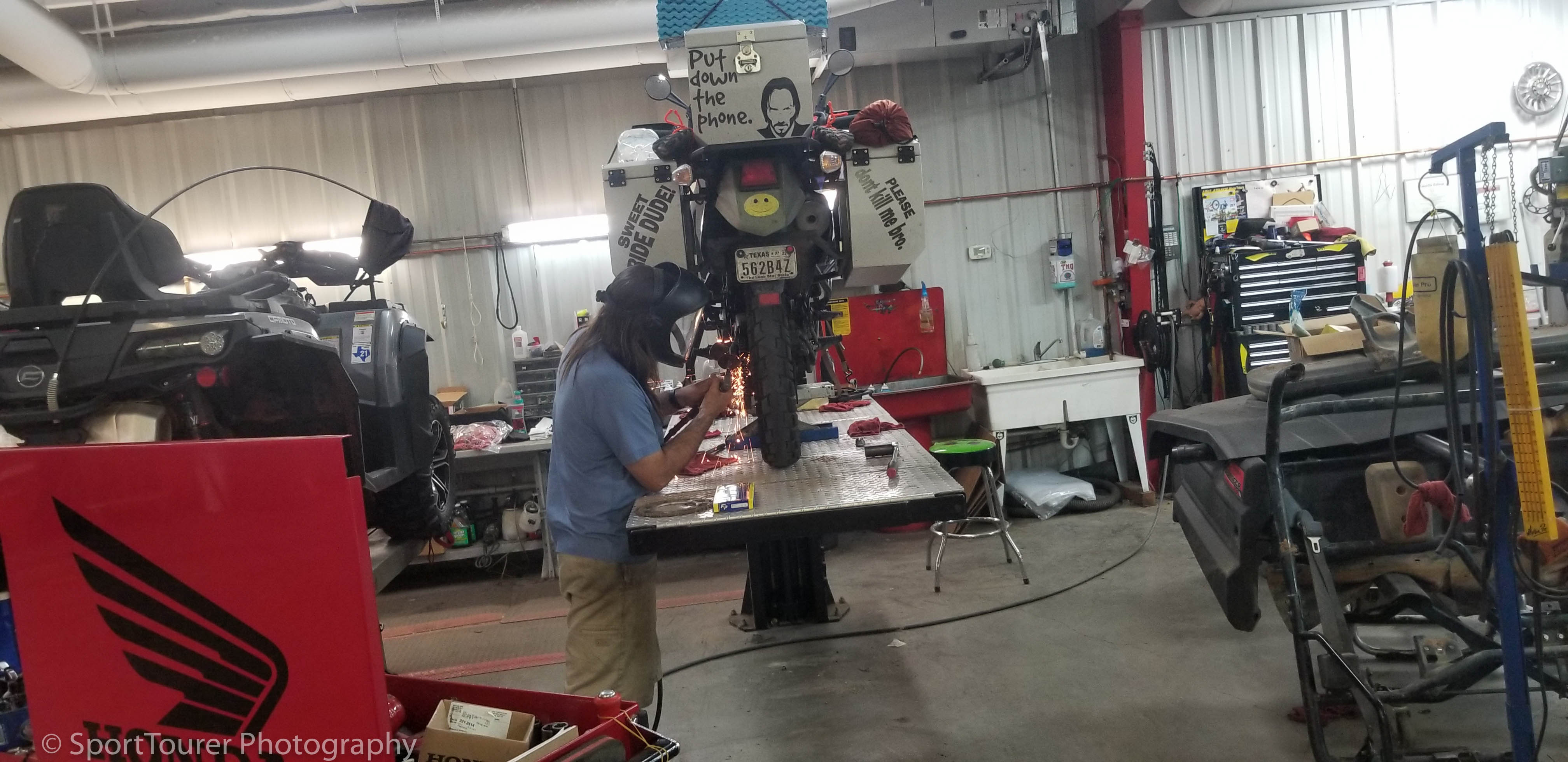  My buddy's bike getting some needed mechanical repairs during his return trip to Texas from Sheridan, WY 