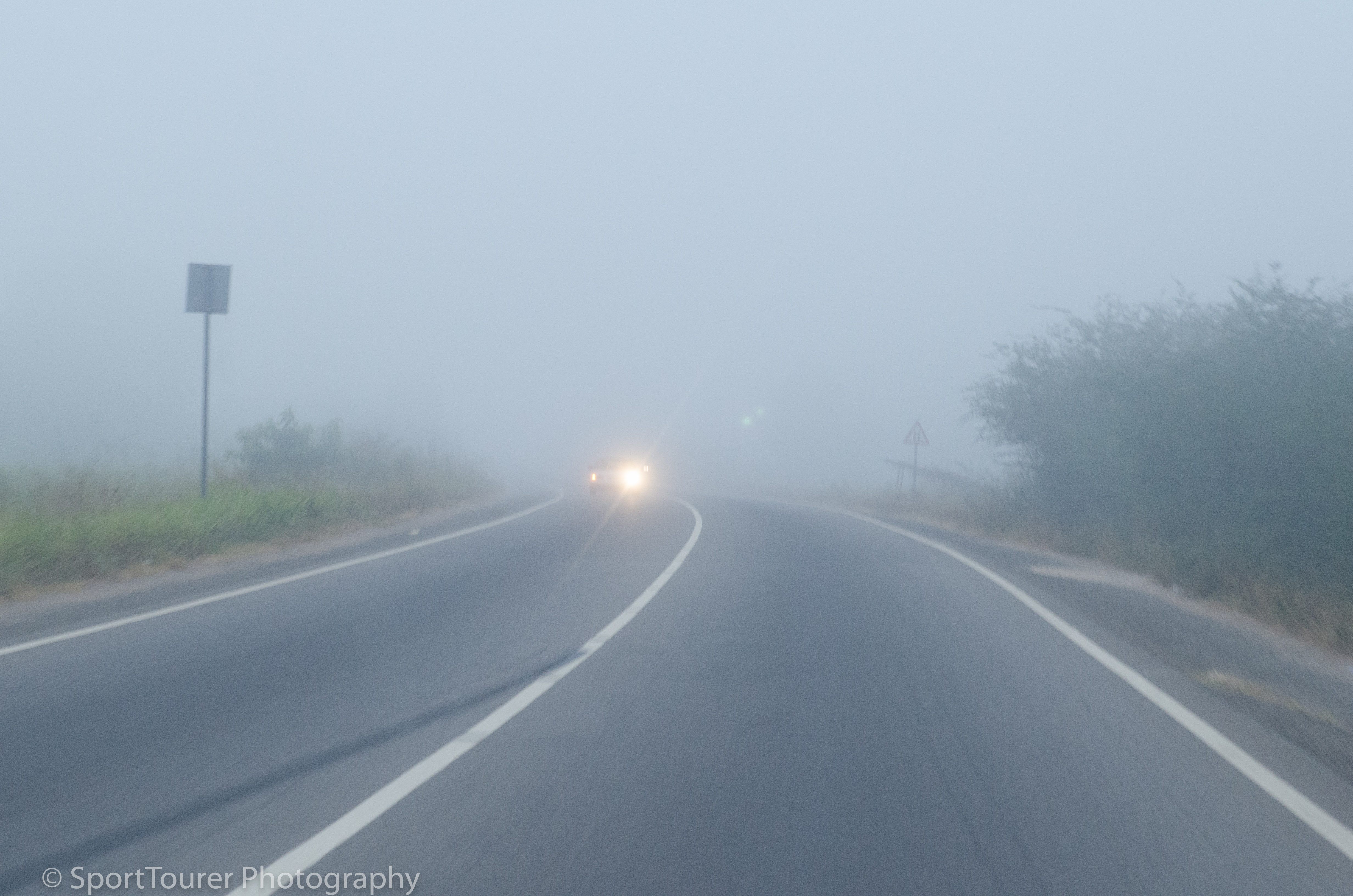  Accra-Cape Coast road shrouded in a haze of Harmattan dust in the air. November 2015. 