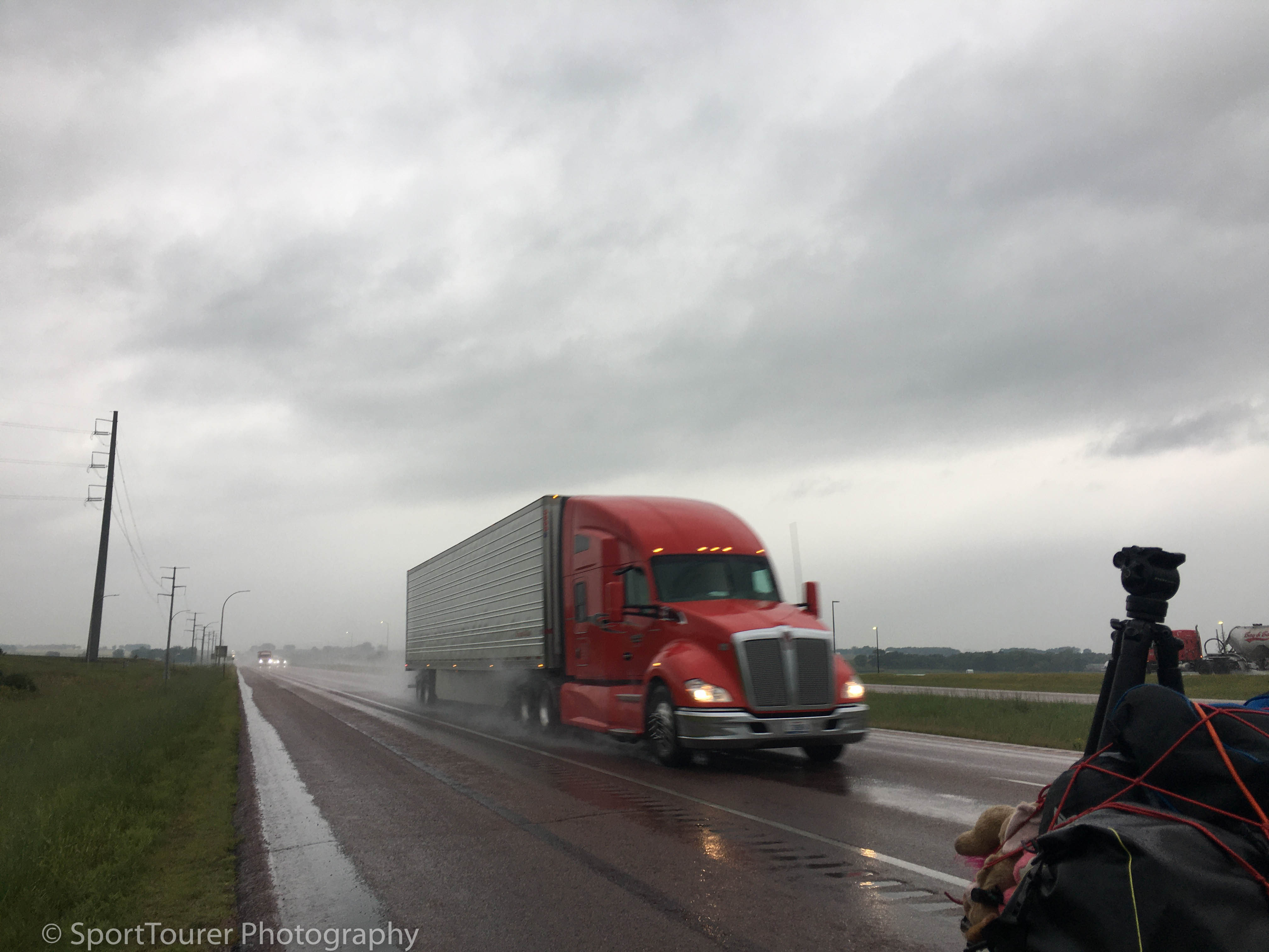  Caught in an early morning rainstorm (that lasted all day) at the side of the highway at the South Dakota/Minnesota state line 