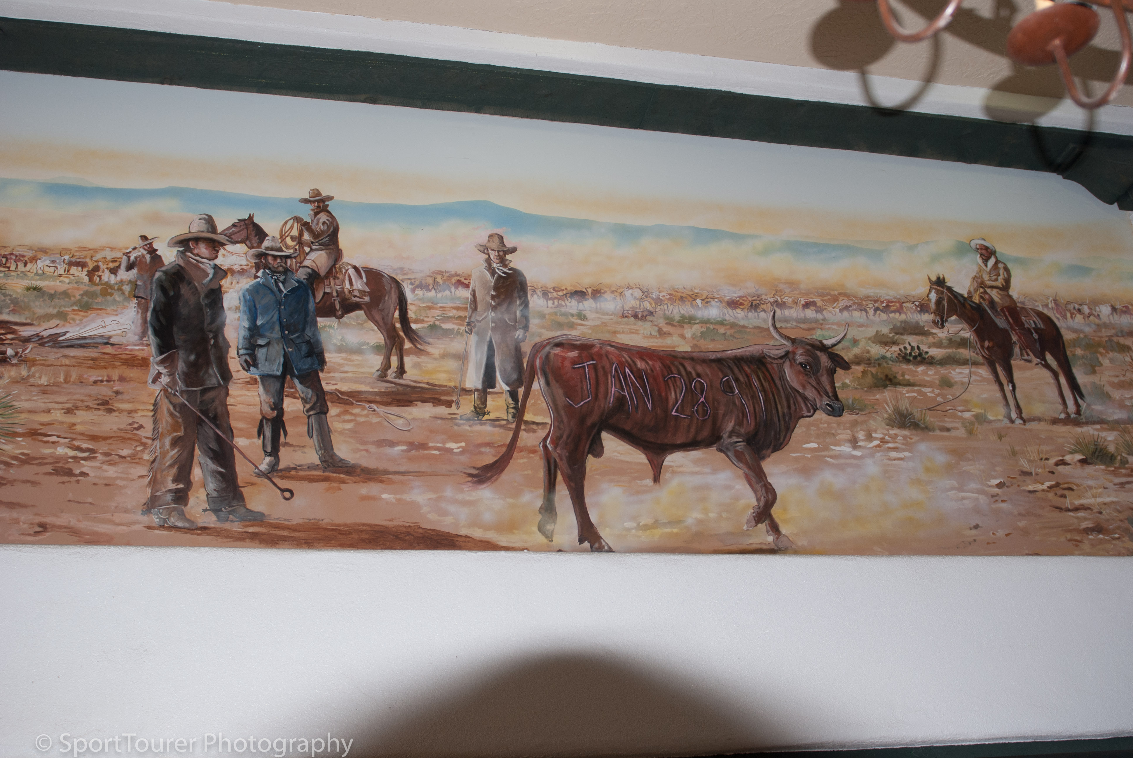  Painting by a local artist, depicting a typical day in the life of cowboys in this area during those times. 