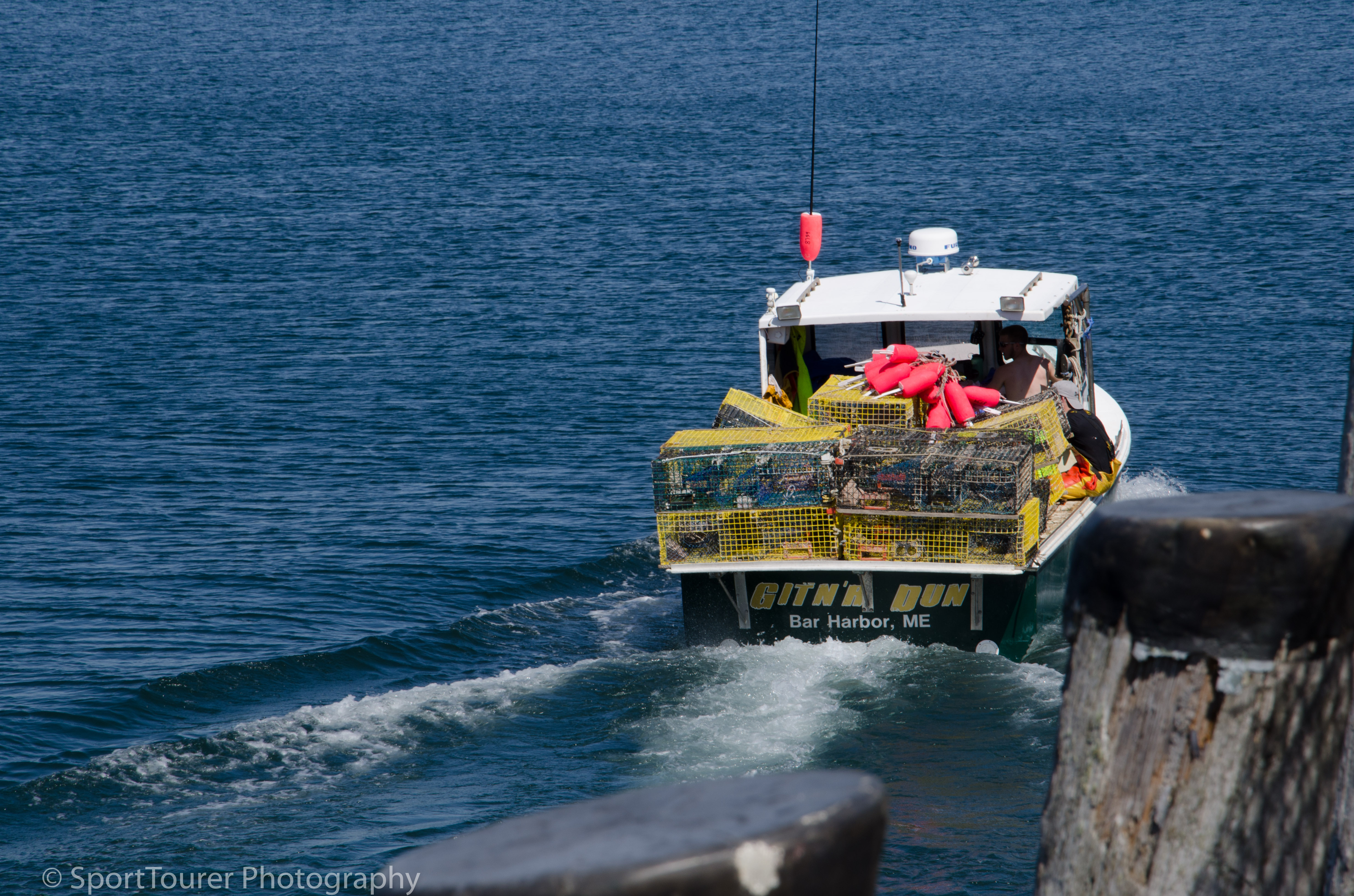 Lobster fishermen heading out from Bar Harbor to retrieve and set traps. 